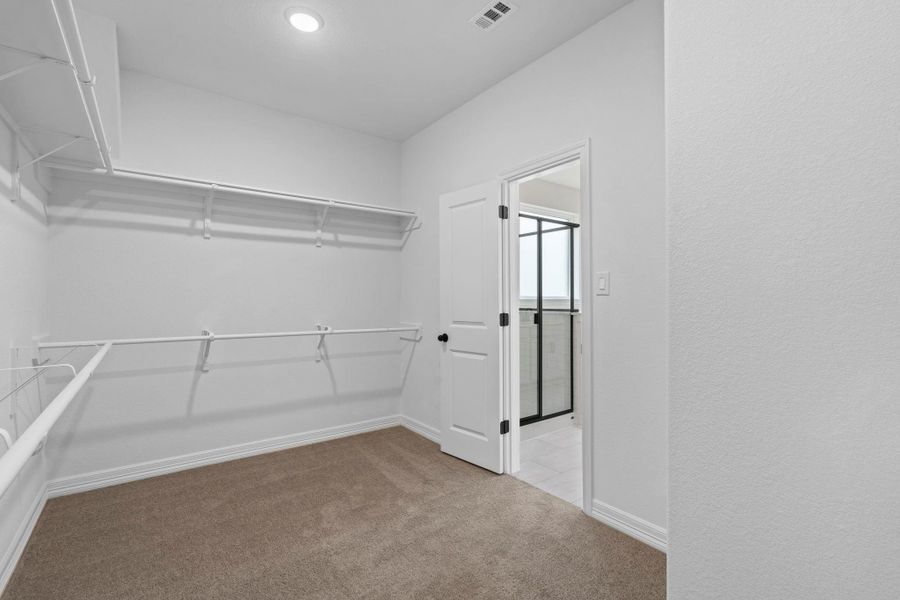 A view of your large primary walk-in Closet