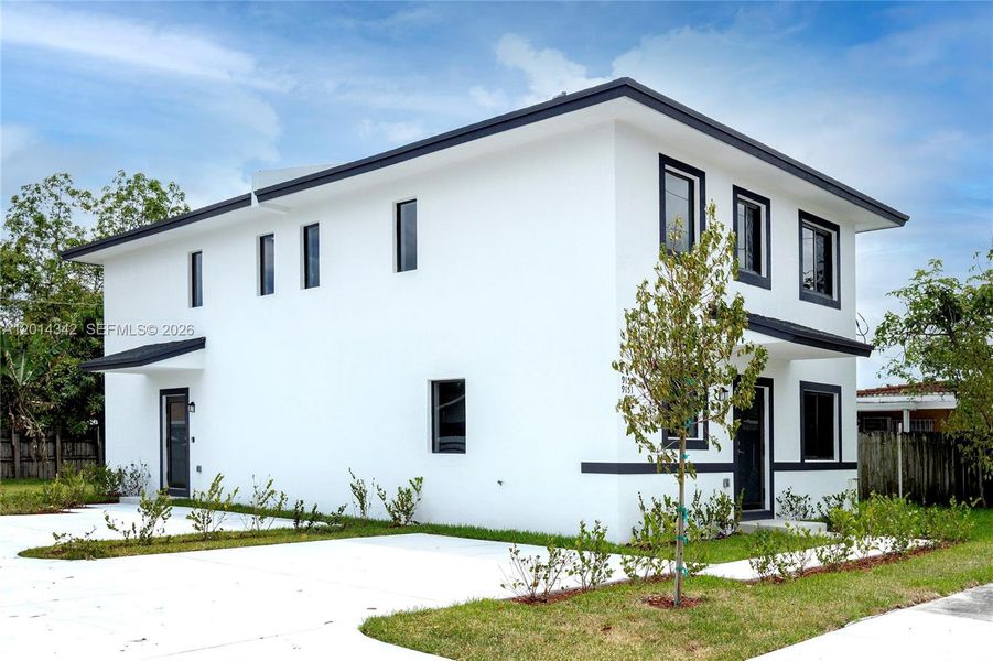 Front exterior of a new home in , Miami, FL, highlighting curb appeal (Image 1). Front exterior of a new home in , Miami, FL, highlighting curb appeal (Image 1).