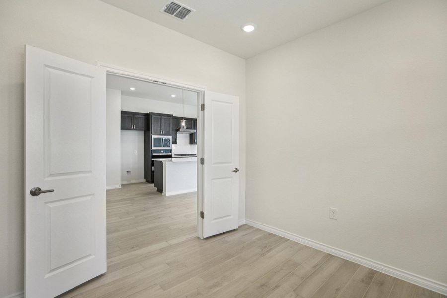 Empty room featuring recessed lighting and light wood-style floors