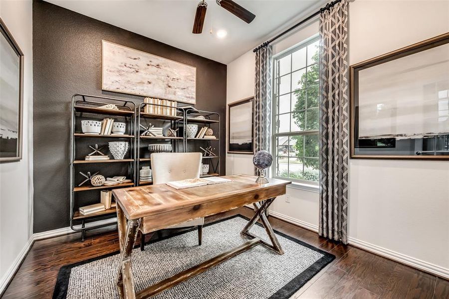 Home office featuring dark wood finished floors and ceiling fan