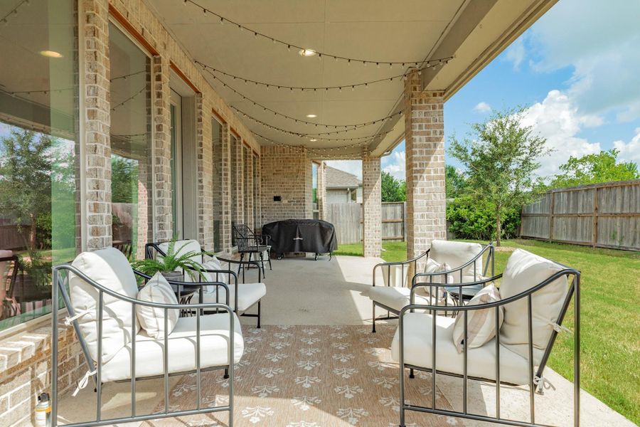 Another view of this spacious extended patio, perfect for outdoor dining and entertaining while enjoying the peaceful backyard scenery Another view of this spacious extended patio, perfect for outdoor dining and entertaining while enjoying the peaceful backyard scenery