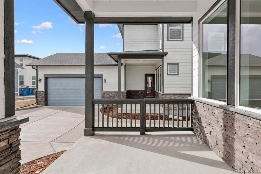 Exterior details and patio area of a home in Painted Prairie Cottage, Aurora (Image 3).