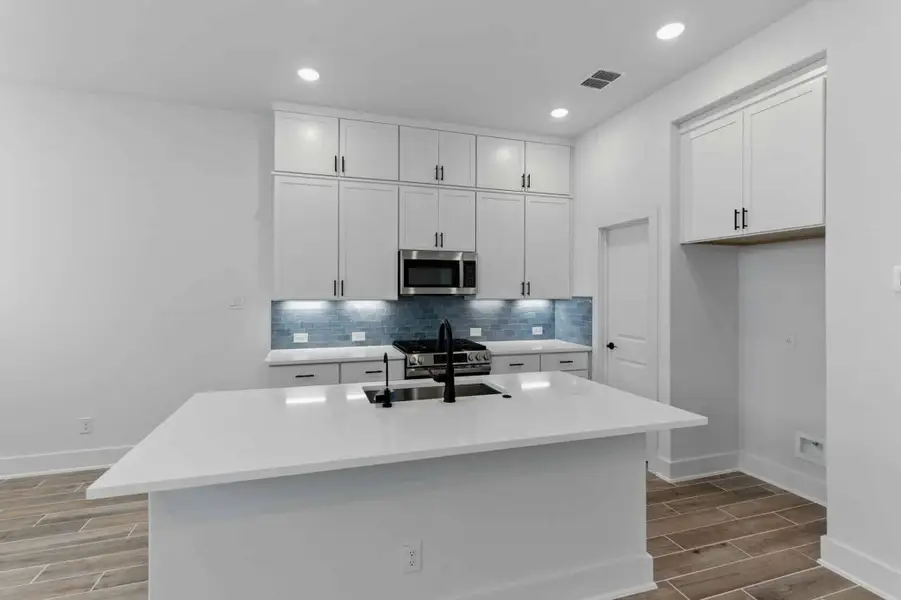 Furnished interior view inside a new home in Rose Hill, San Antonio (Image 4).