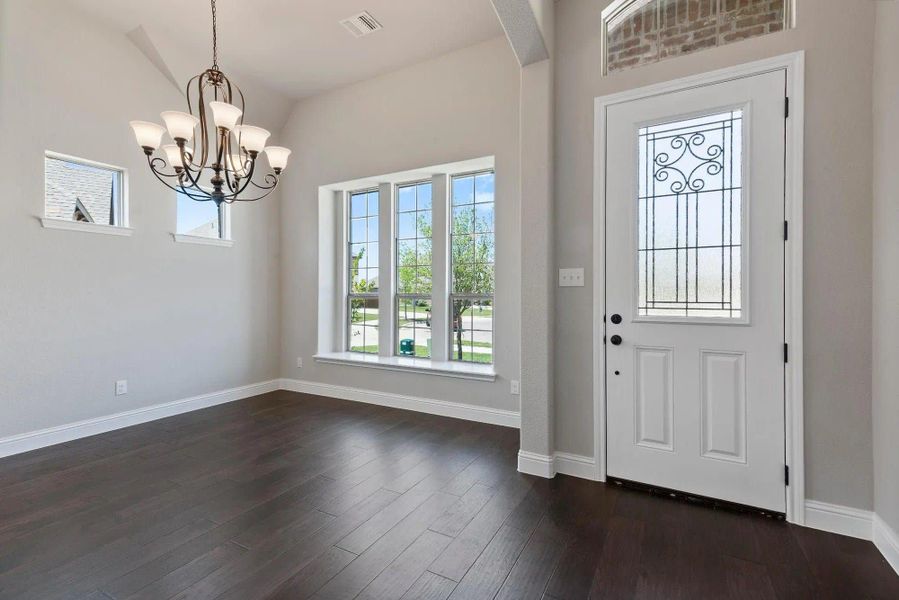 Dining Room and Entry | Concept 3015 at Silo Mills - Signature Series in Joshua, TX by Landsea Homes