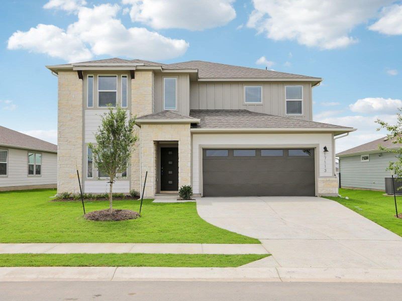 Prairie-style home featuring stone siding, concrete driveway, roof with shingles, a front lawn, and central air condition unit Prairie-style home featuring stone siding, concrete driveway, roof with shingles, a front lawn, and central air condition unit