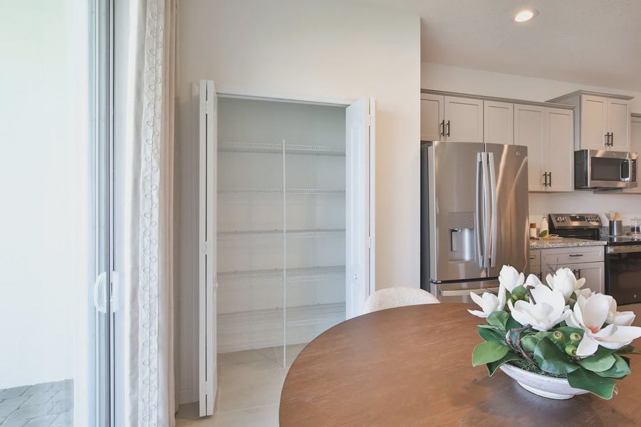 Representative furnished interior of a home built from the Morgan by Neal Communities in SkySail, Naples (Image 16).