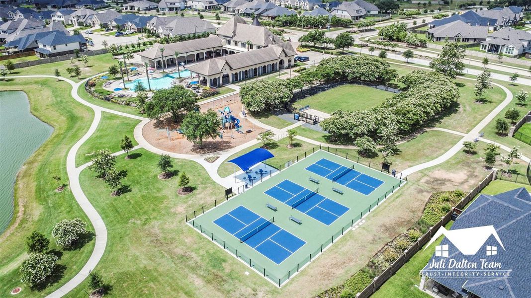 The outdoor area at the resort features pickleball courts, a playground, and a dog park. The resort also features an indoor fitness center and party room.