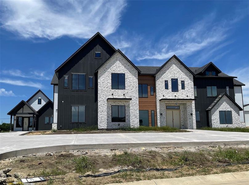 Front exterior of a new home in Capitol Hill, Anna, TX, highlighting curb appeal (Image 2). Front exterior of a new home in Capitol Hill, Anna, TX, highlighting curb appeal (Image 2).