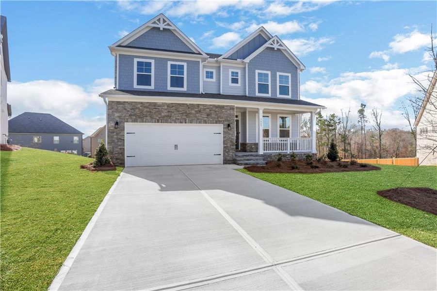 Front exterior of a new home in Cambridge, Flowery Branch, GA, highlighting curb appeal (Image 22).