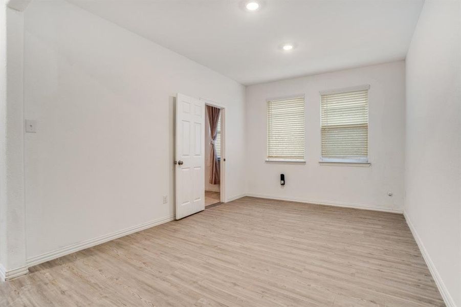 Empty room featuring light wood finished floors