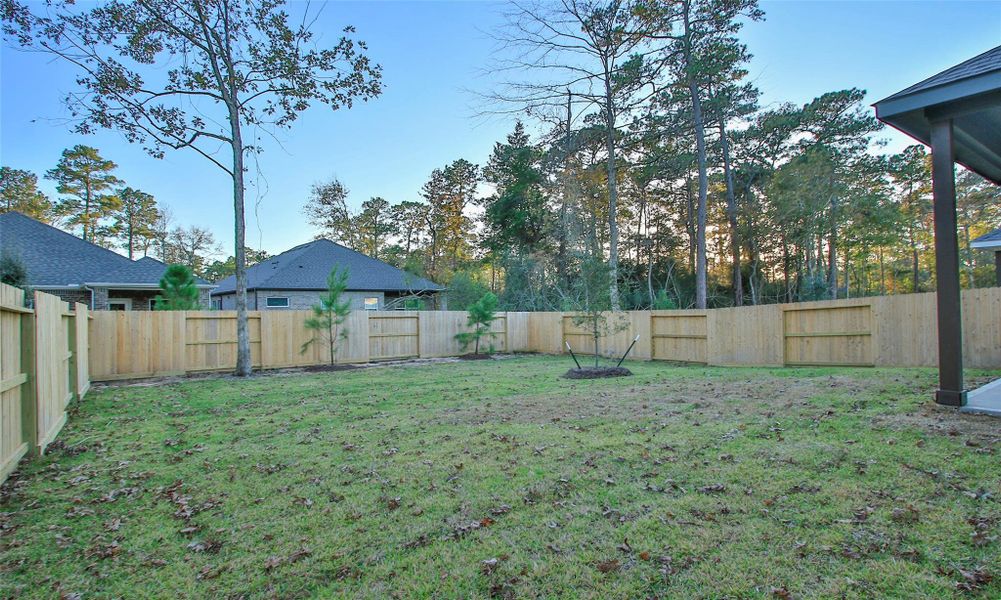 Exterior details and patio area of a home in The Woodlands Hills, Willis (Image 3). Exterior details and patio area of a home in The Woodlands Hills, Willis (Image 3).