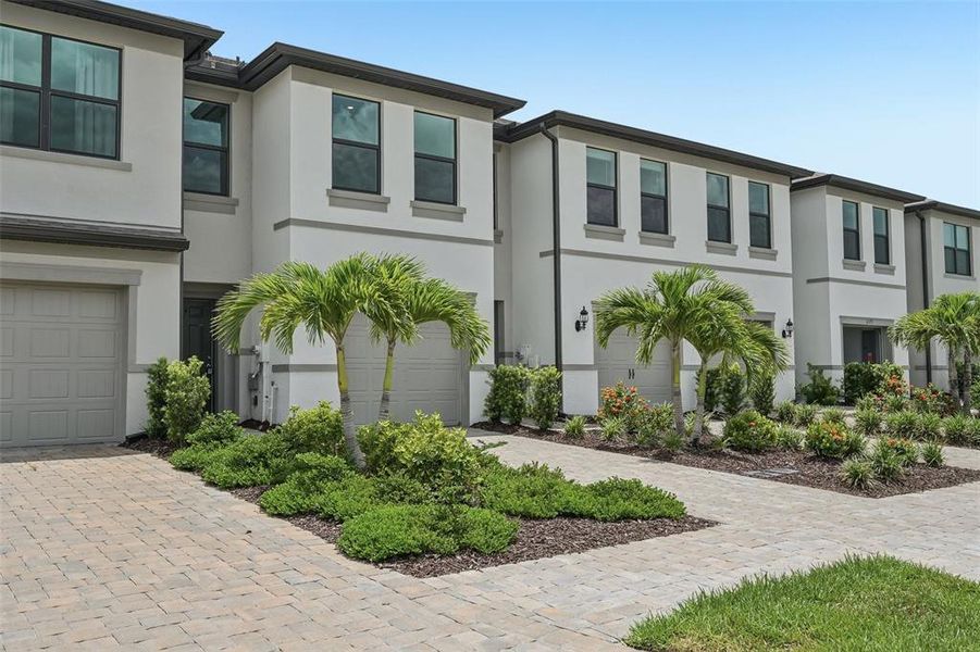 Front exterior of a new home in , Sarasota, FL, highlighting curb appeal (Image 25).
