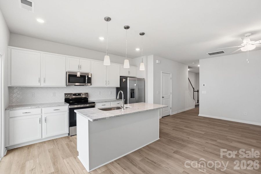 Furnished interior view inside a new home in Sloan Station, Charlotte (Image 6).