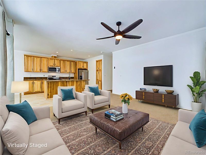 Open floor plan living room looking in to the kitchen...