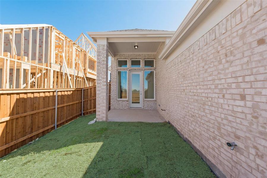 Exterior details and patio area of a home in Trails at Cottonwood Creek, Rowlett (Image 2).