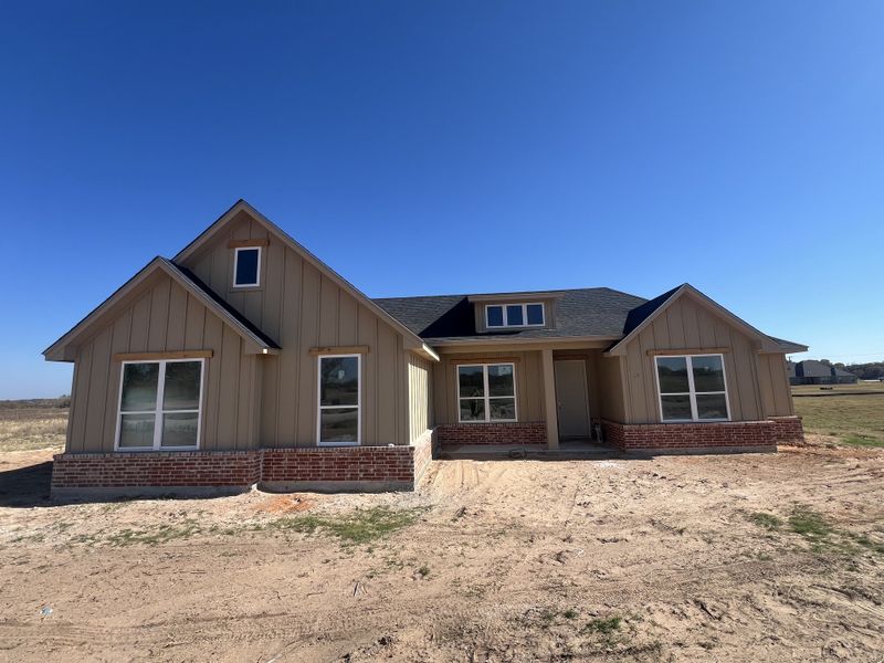 Front exterior of a new home in Zion Valley, Poolville, TX, highlighting curb appeal (Image 1). Front exterior of a new home in Zion Valley, Poolville, TX, highlighting curb appeal (Image 1).