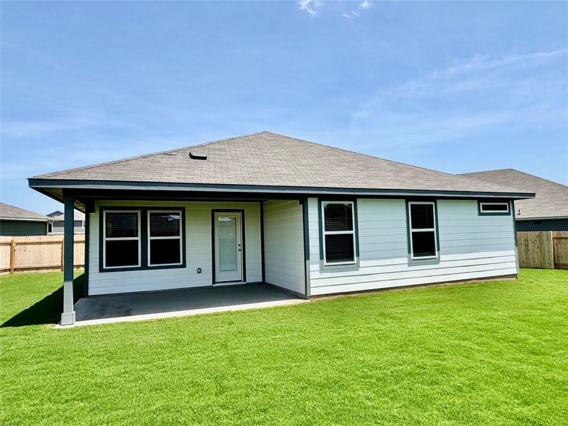 Rear view of property with roof with shingles and a patio Rear view of property with roof with shingles and a patio