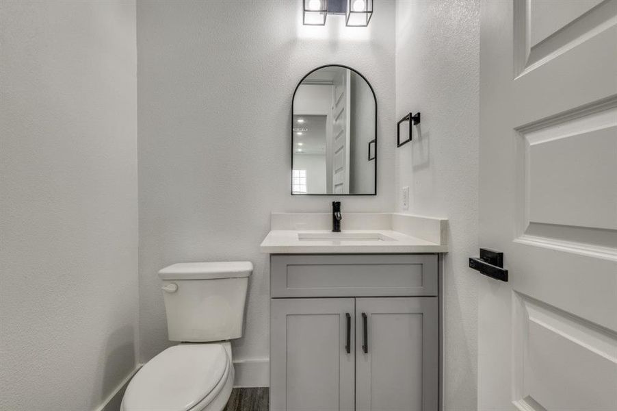 Bathroom with vanity and toilet