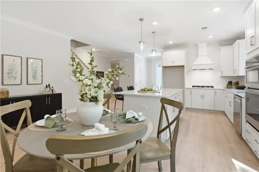 An open kitchen and dining layout showcases light