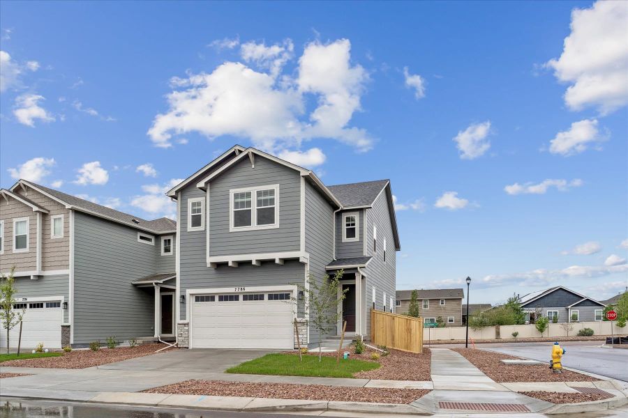 Front exterior of a new home in Aspen Meadows, Colorado Springs, CO, highlighting curb appeal (Image 2). Front exterior of a new home in Aspen Meadows, Colorado Springs, CO, highlighting curb appeal (Image 2).