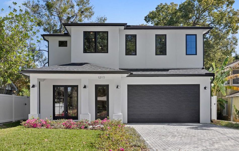 Front exterior of a new home in , Orlando, FL, highlighting curb appeal (Image 32).