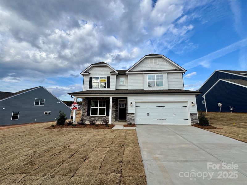 Front exterior of a new home in Carrington, Stanley, NC, highlighting curb appeal (Image 1).