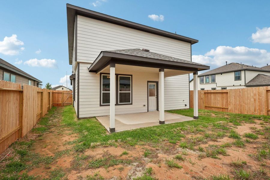 Exterior details and patio area of a home in Bluestem, Brookshire (Image 2). Exterior details and patio area of a home in Bluestem, Brookshire (Image 2).