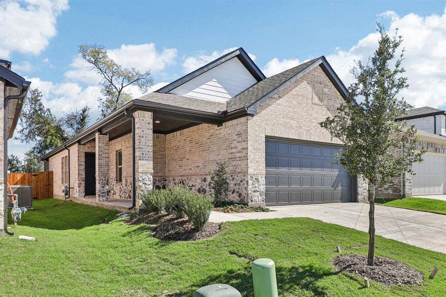 Front exterior of a new home in Eastridge - Spring Series, McKinney, TX, highlighting curb appeal (Image 2). Front exterior of a new home in Eastridge - Spring Series, McKinney, TX, highlighting curb appeal (Image 2).