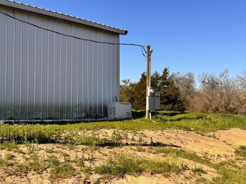 View of side of home with an outbuilding and metal roof View of side of home with an outbuilding and metal roof