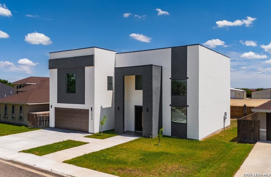 Front exterior of a new home in , Harlingen, TX, highlighting curb appeal (Image 29).