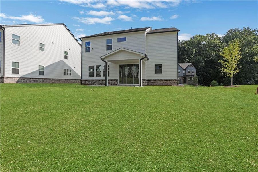 Exterior details and patio area of a home in The Paddocks at Doc Hughes, Buford (Image 23).