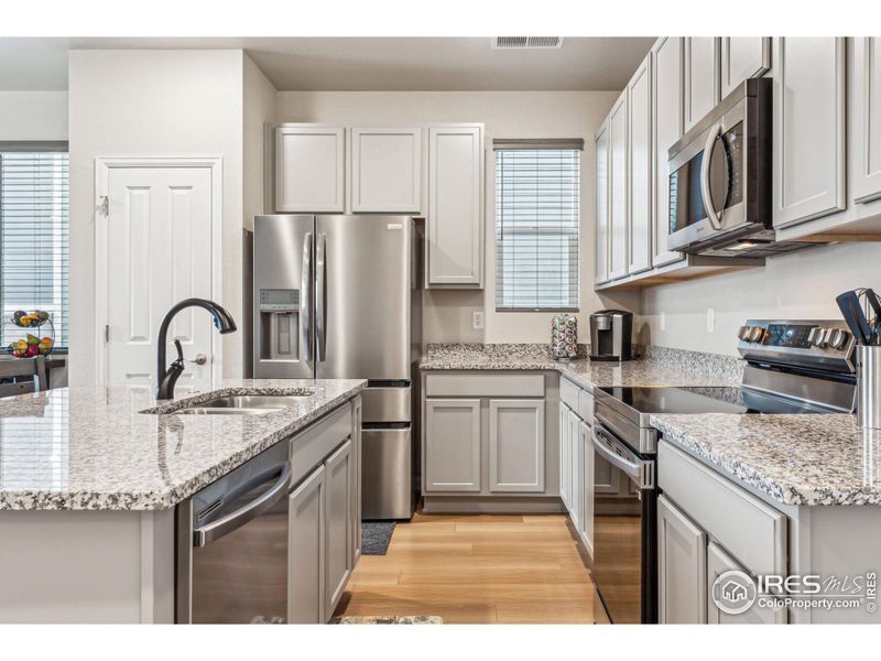 Upgraded granite countertops, stainless steel appliances, all less than a year old