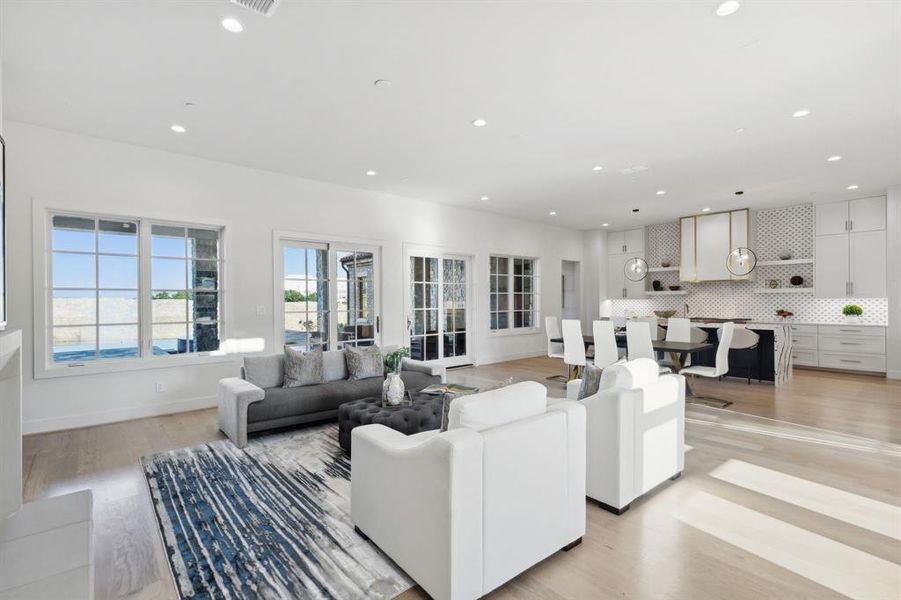 Living room with light hardwood / wood-style floors