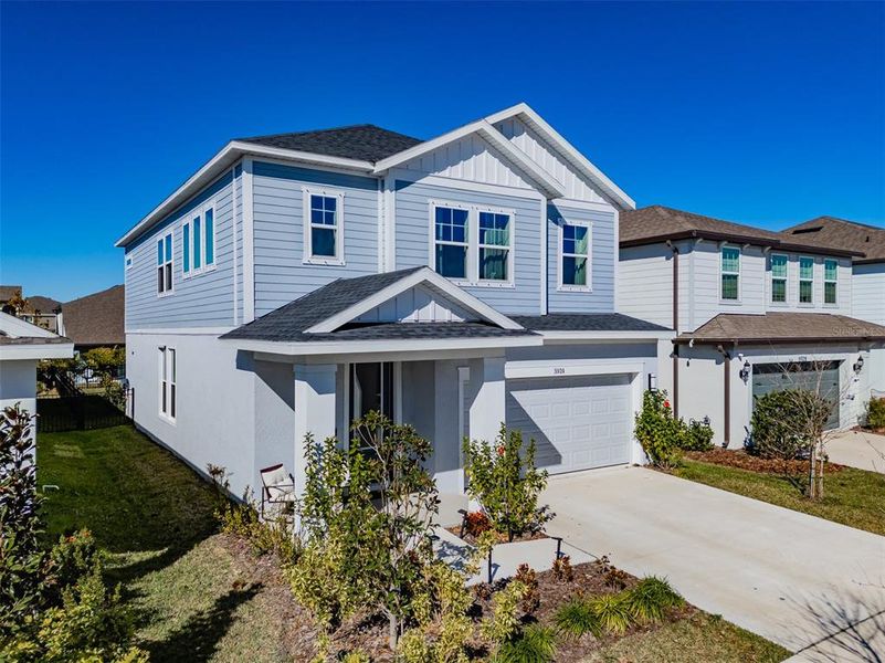 Front exterior of a new home in Waterset Garden Series, Apollo Beach, FL, highlighting curb appeal (Image 22).
