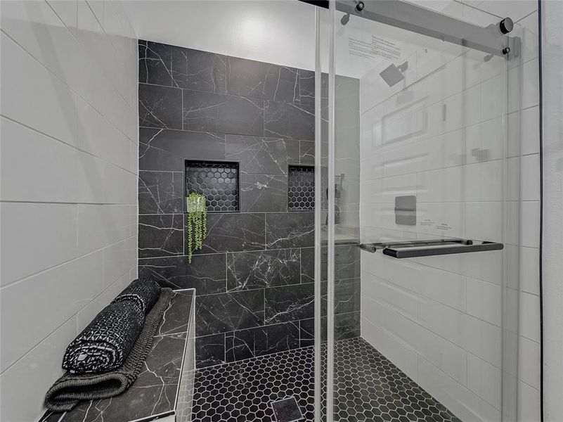 Bathroom with a shower with door