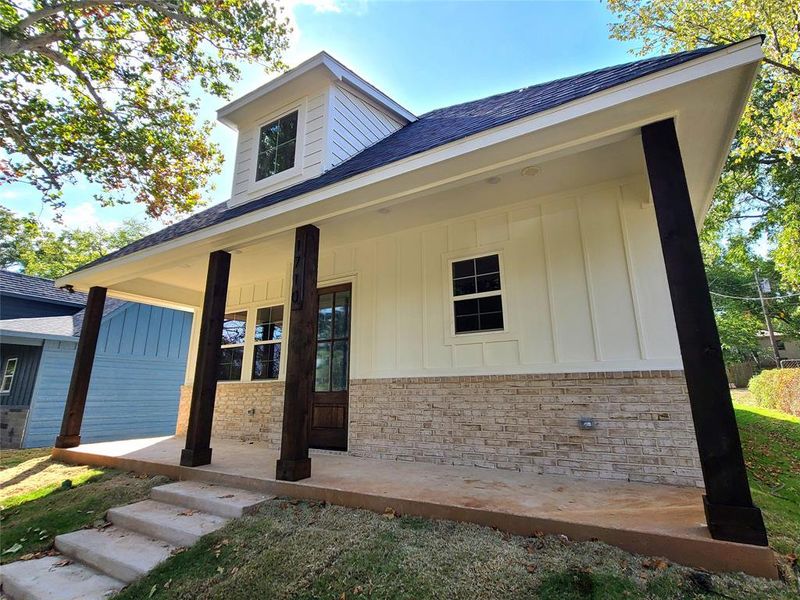 Doorway to property featuring a porch