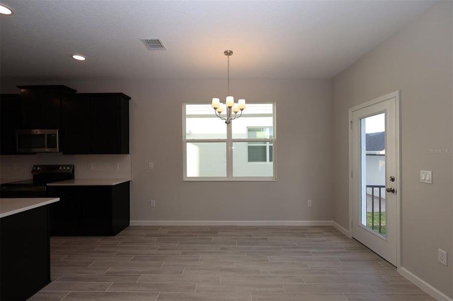 Spacious, unfurnished interior of a new home in Tribute at Ovation, Winter Garden (Image 17).