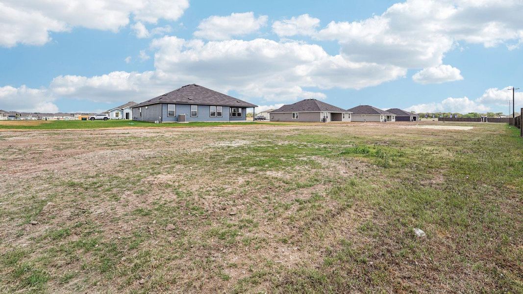 Exterior details and patio area of a home in Railhead, Cedar Creek (Image 19).