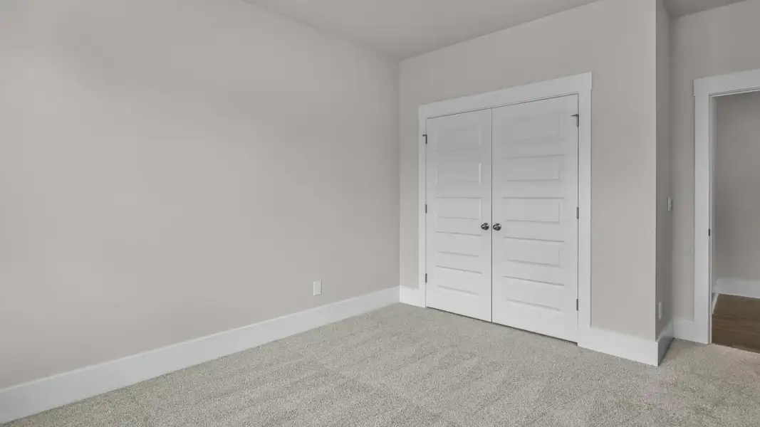 Representative unfurnished interior of a home built from the Forrester by D.R. Horton in The Highlands at Cedar Hill Landing, Navassa (Image 23).