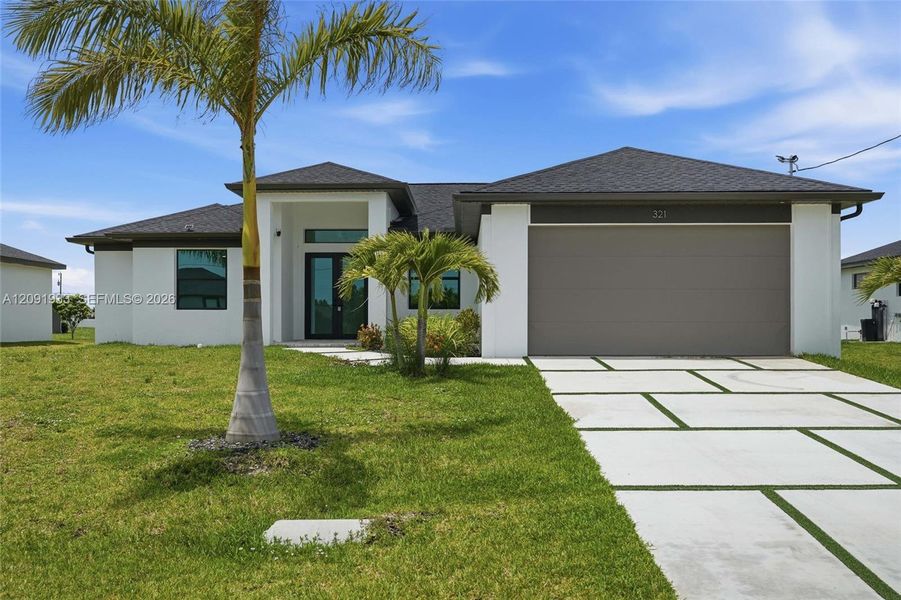 Front exterior of a new home in , Cape Coral, FL, highlighting curb appeal (Image 18). Front exterior of a new home in , Cape Coral, FL, highlighting curb appeal (Image 18).