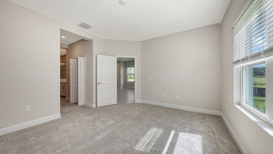 Spacious, unfurnished interior of a new home in Wildleaf Real Estate and Homes for Sale in Parrish, FL - Neal Communities, Parrish (Image 38). Spacious, unfurnished interior of a new home in Wildleaf Real Estate and Homes for Sale in Parrish, FL - Neal Communities, Parrish (Image 38).