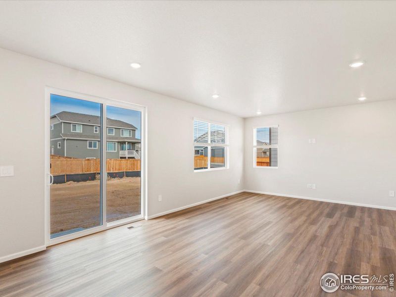 Great room with sliding door to the backyard