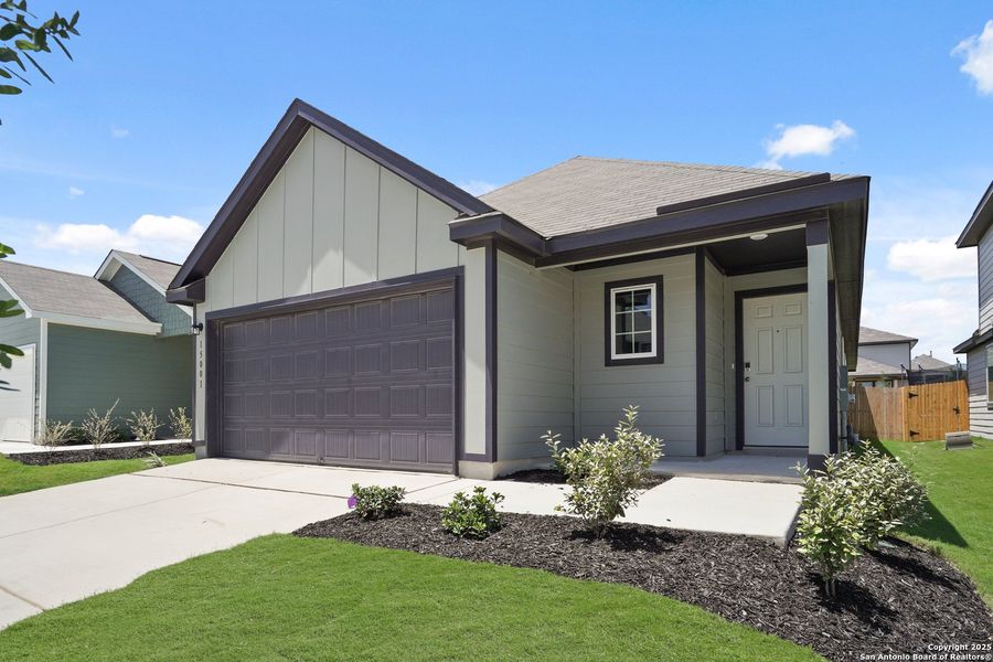 Front exterior of a new home in Timber Creek, San Antonio, TX, highlighting curb appeal (Image 14).