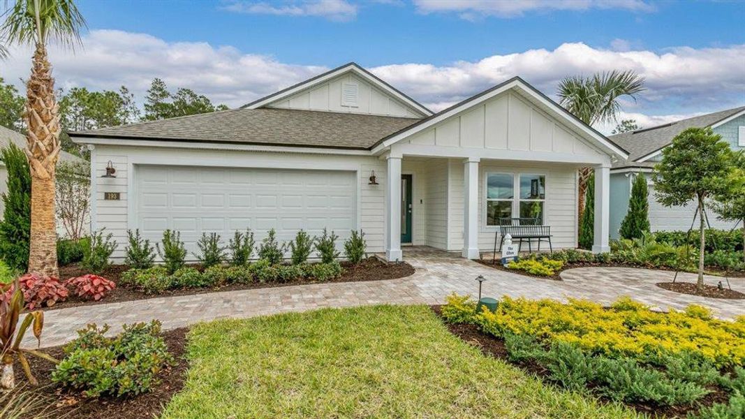 Front exterior of a new home in Sawmill Branch Express, Palm Coast, FL, highlighting curb appeal (Image 20).