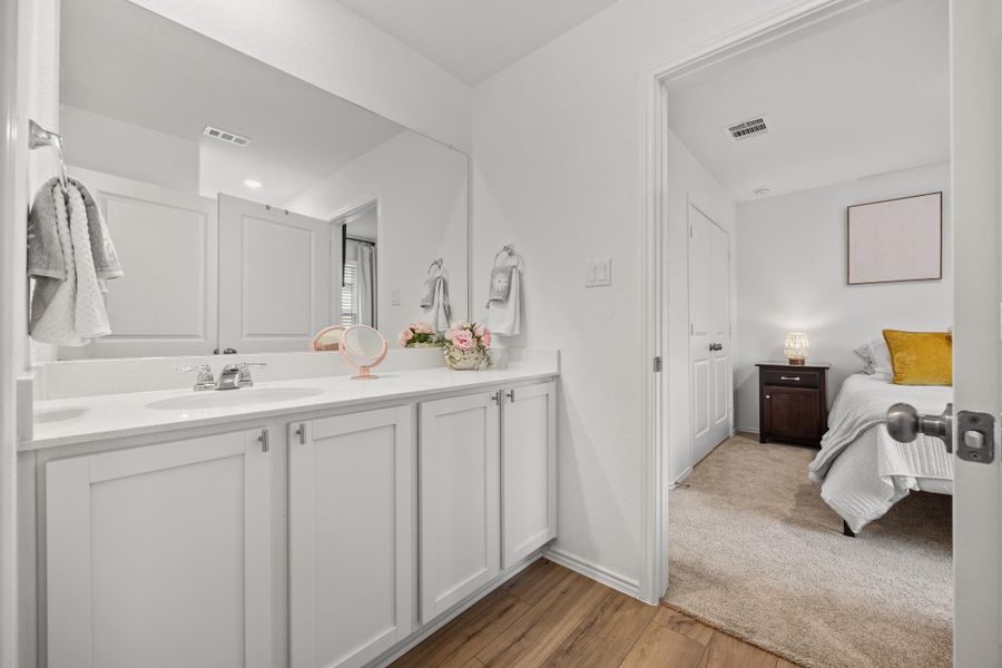 LVP wood-look floor is easy care in this middle bath leading to 2 of the 4 bedrooms. LVP wood-look floor is easy care in this middle bath leading to 2 of the 4 bedrooms.