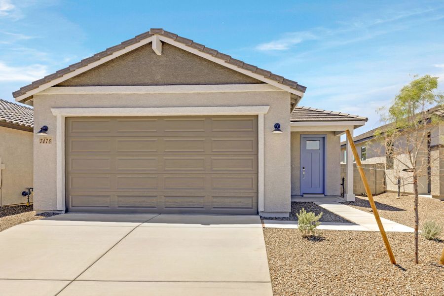 Front exterior of a new home in Blackhawk, Tucson, AZ, highlighting curb appeal (Image 1). Front exterior of a new home in Blackhawk, Tucson, AZ, highlighting curb appeal (Image 1).