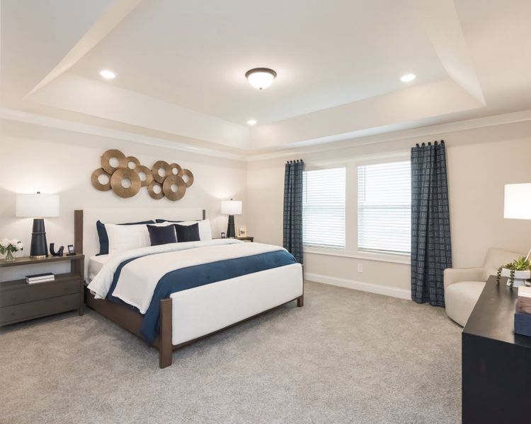 The primary suite is a private retreat to relax and unwind.