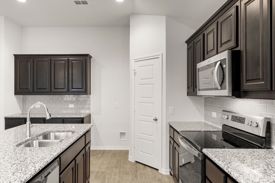 Representative exterior photo of a completed home built from the Cheyenne by Impression Homes in DeBerry Reserve, Royse City, TX (Image 7).