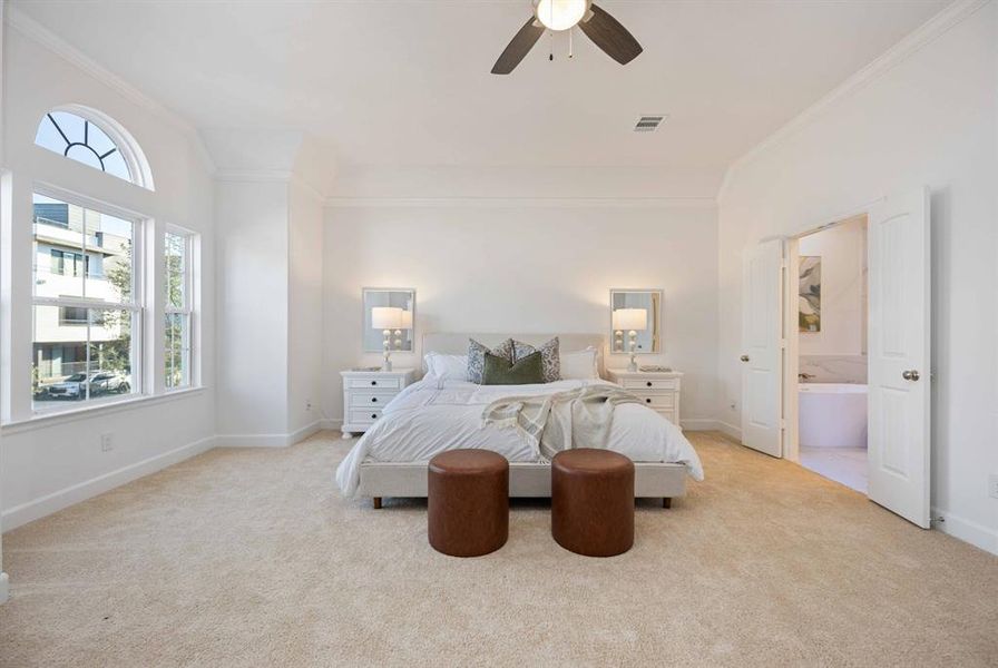 Picture unwinding in this expansive primary bedroom, with a large window inviting in natural light. Plenty of space for your king-sized bed and nightstands.