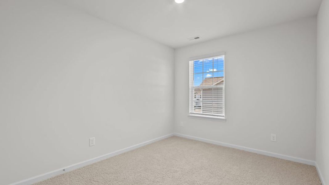 Spacious, unfurnished interior of a new home in The Townes at Ridgewood Farms, Winterville (Image 28).